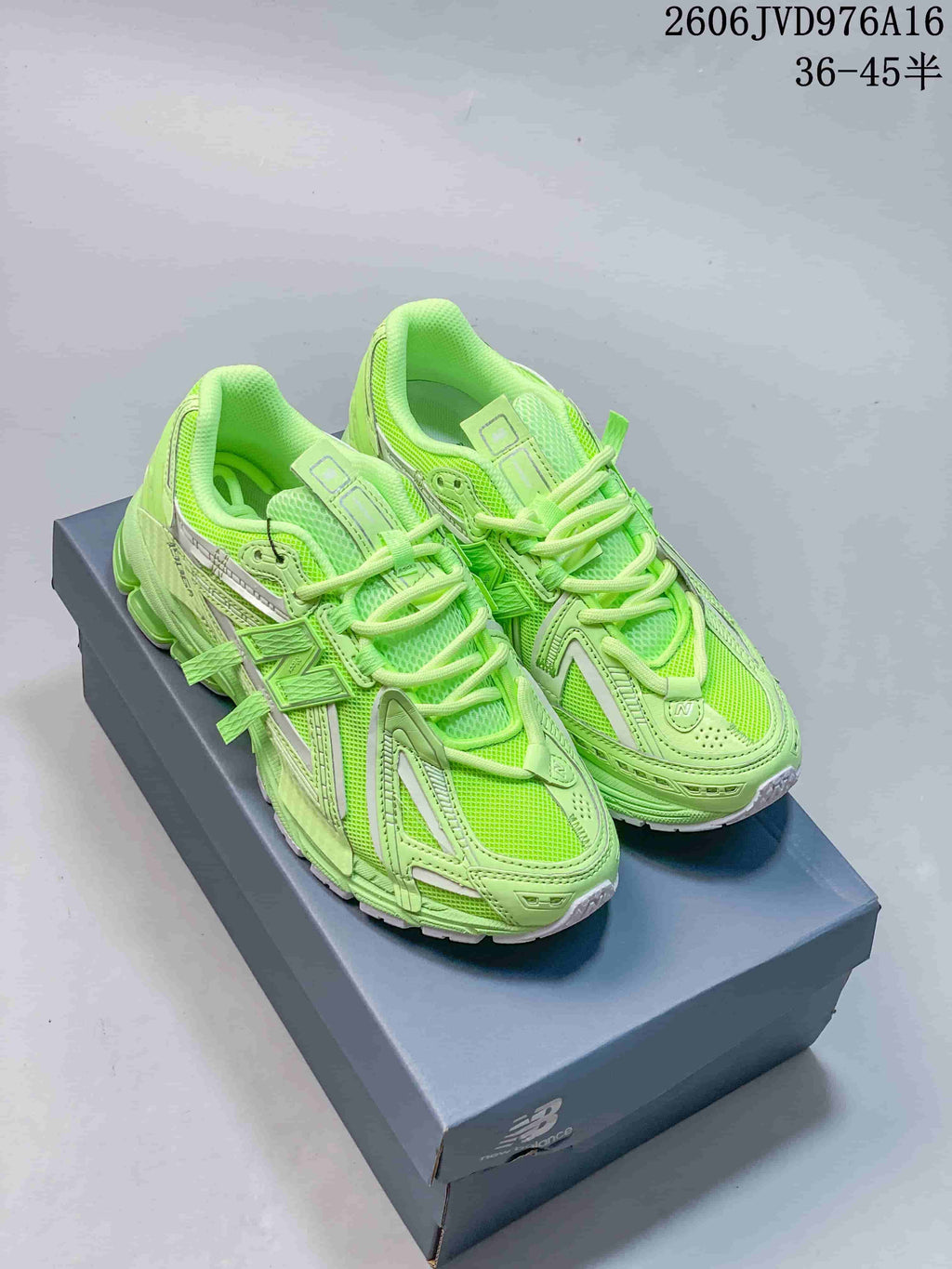 Pair of lime-green New Balance M1906RKC sneakers shown from above at an angle