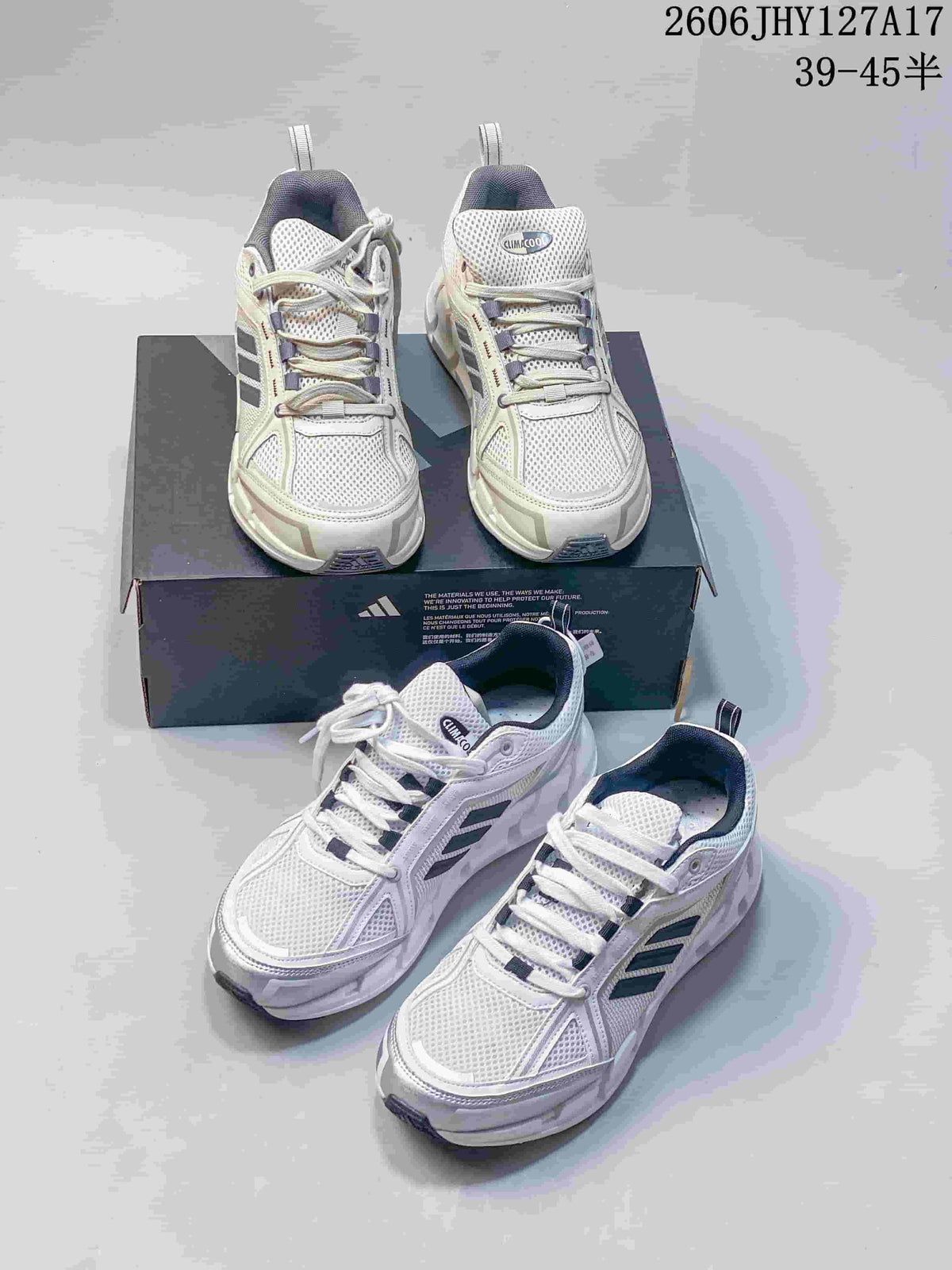 Several views of white Adidas Climacool Ventage shoes with dark side stripes, lace-up fronts and chunky soles.