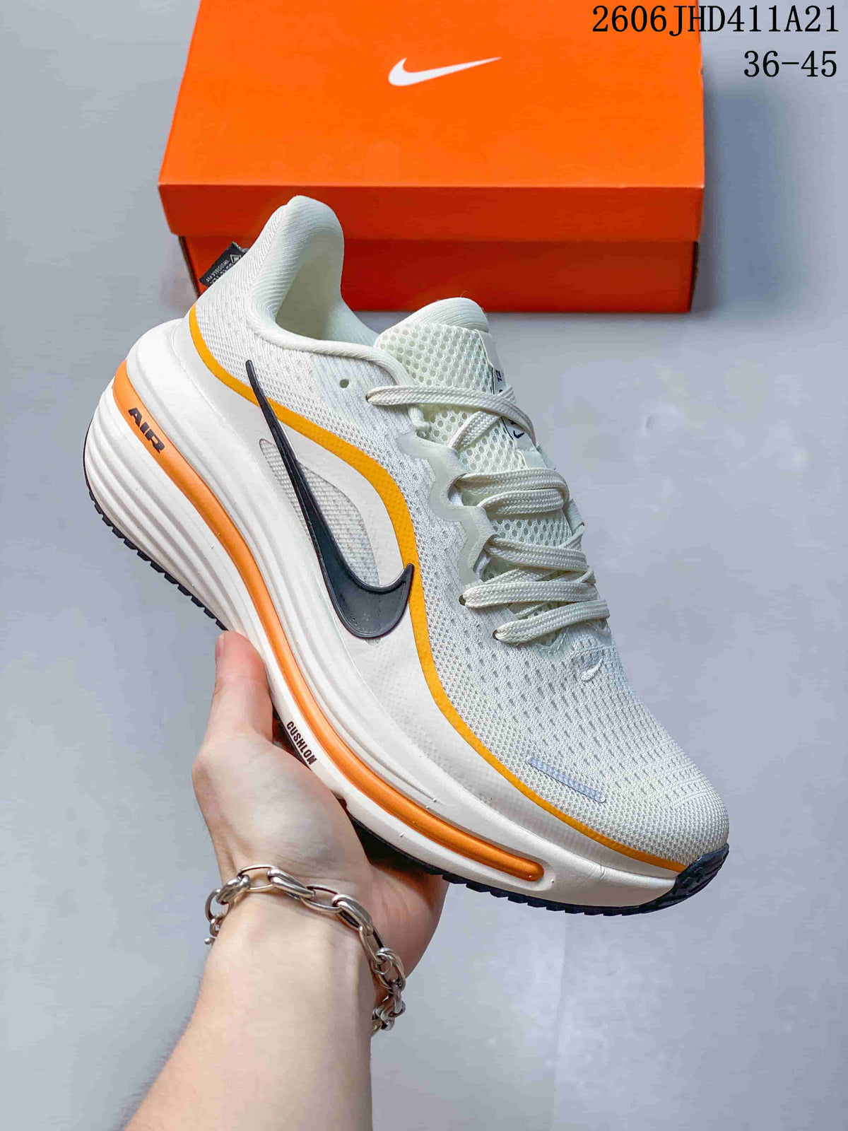 White Nike Air Zoom Winflo 12 with orange accent lines and a dark side logo