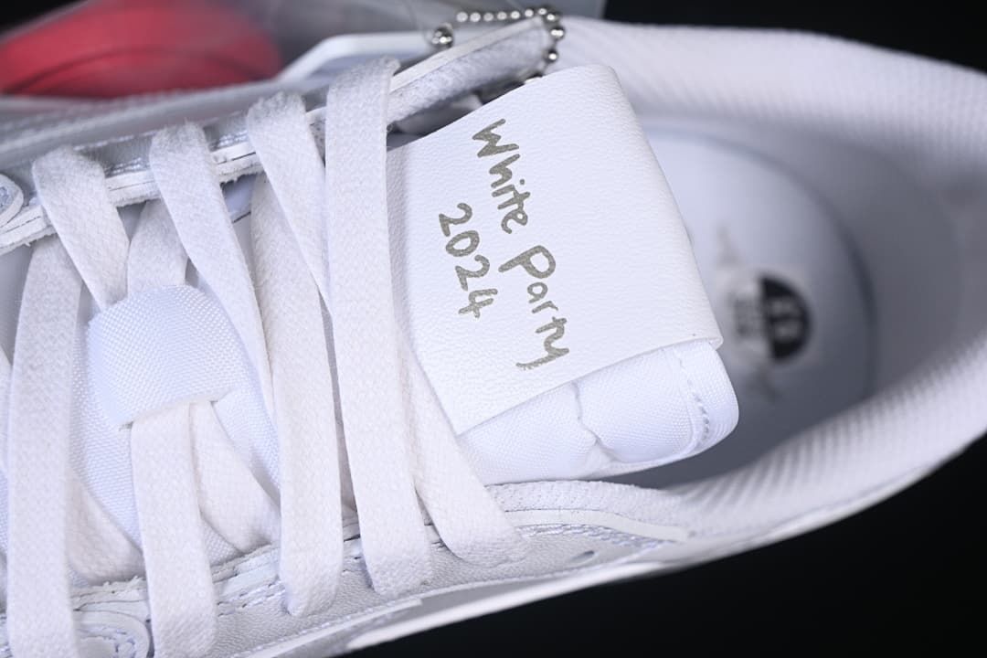 Close-up of the tongue tag with handwritten White Party text
