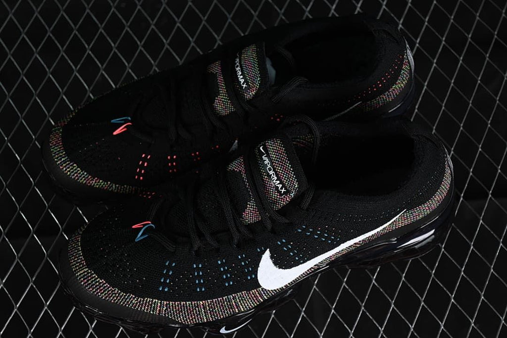 Pair of black VaporMax sneakers with multicolor details, viewed from above