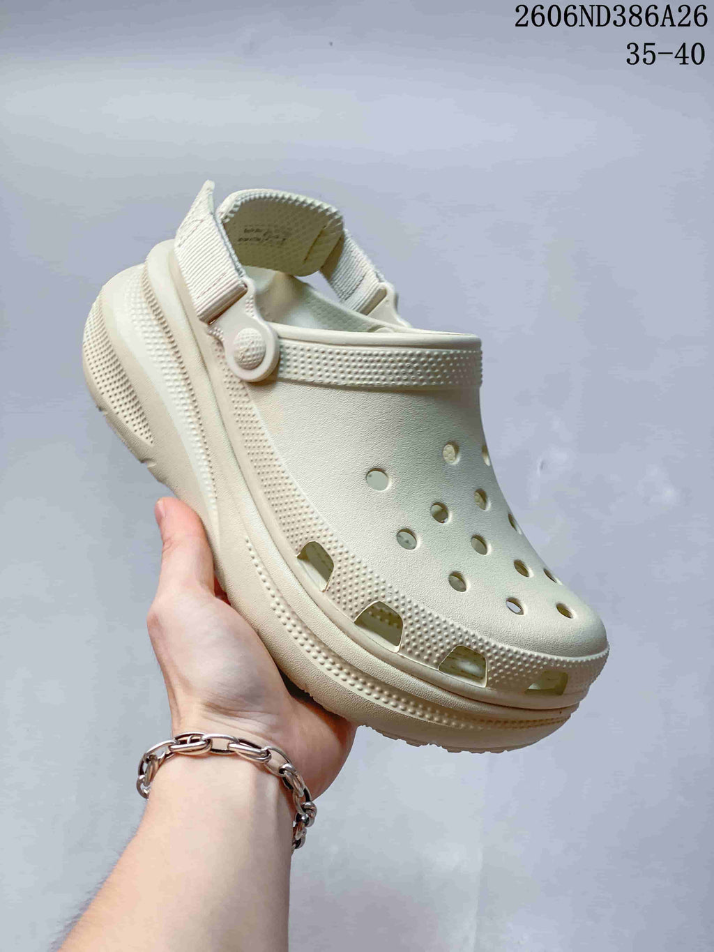 Cream perforated clog sandal with raised textured sole and heel strap