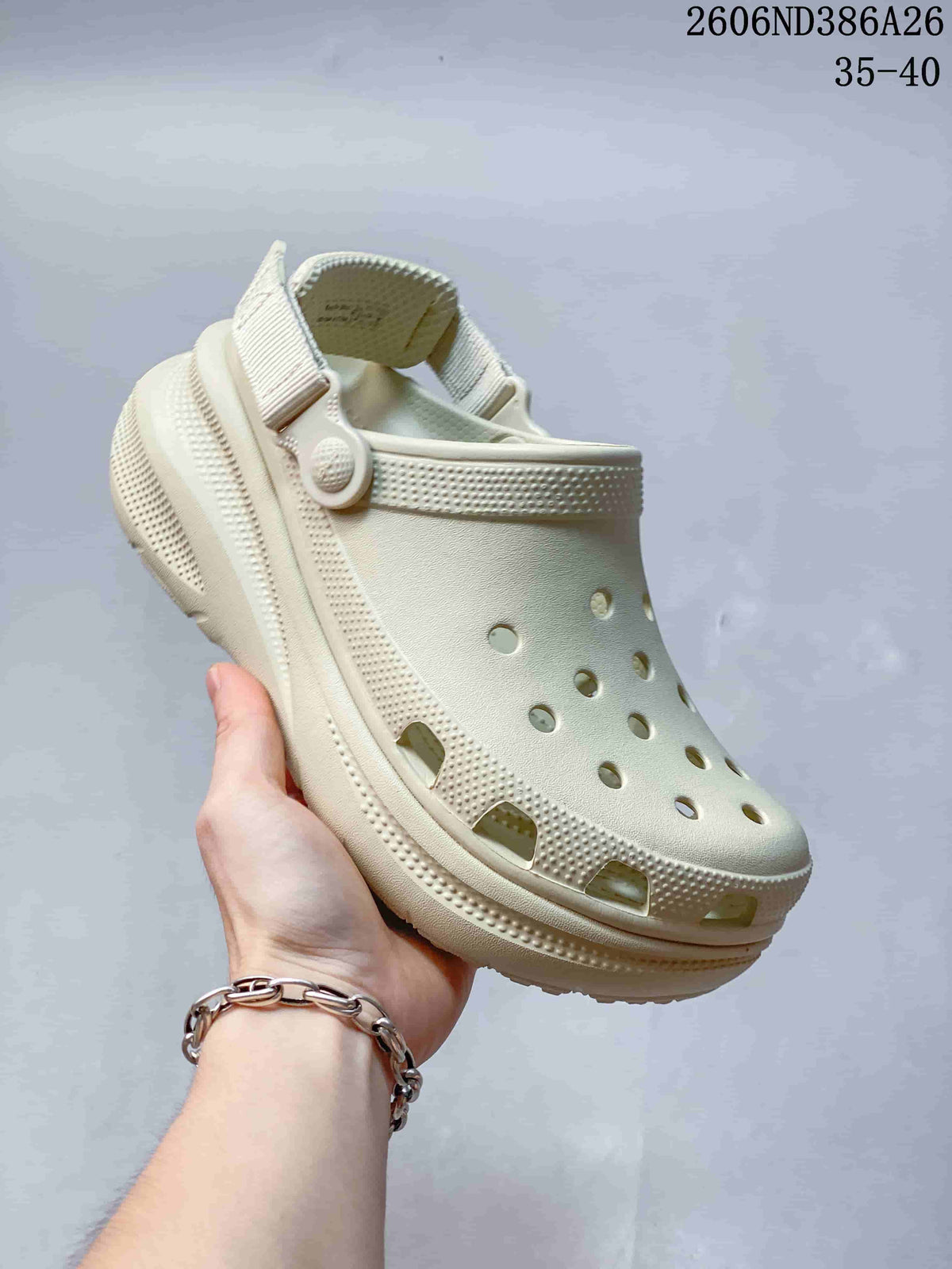 Cream perforated clog sandal with raised textured sole and heel strap