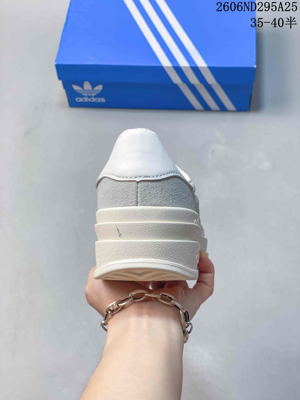 Rear view of the sneaker showing its layered platform heel and white heel panel.