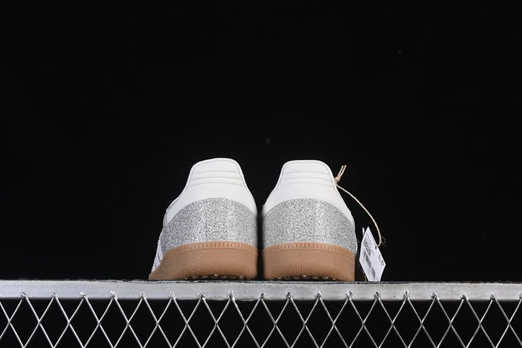 Rear view of the pair showing white heel details and silver glitter-effect panels.