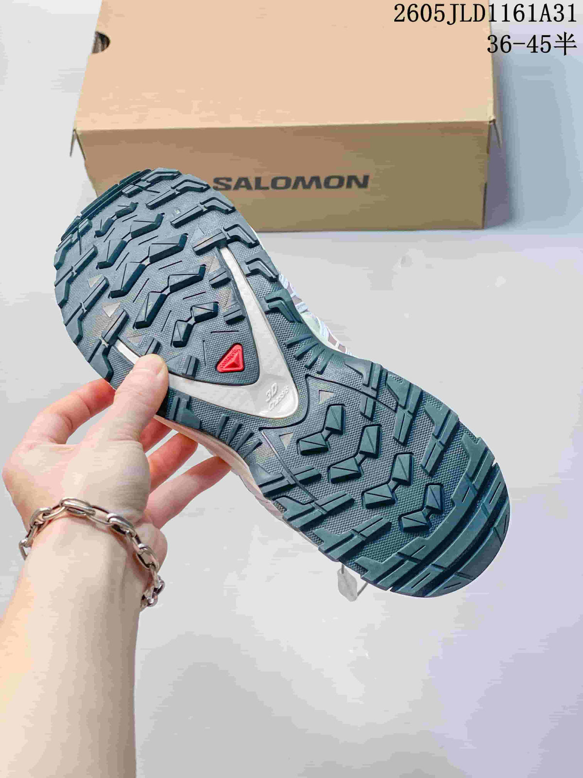 Close-up of the lugged outsole on a Salomon XA Pro 3D sneaker