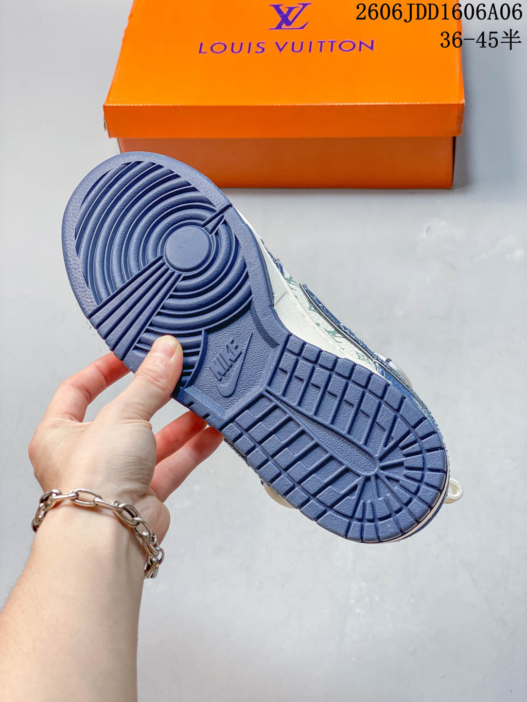 Blue outsole and tread detail of the patterned low-top sneaker