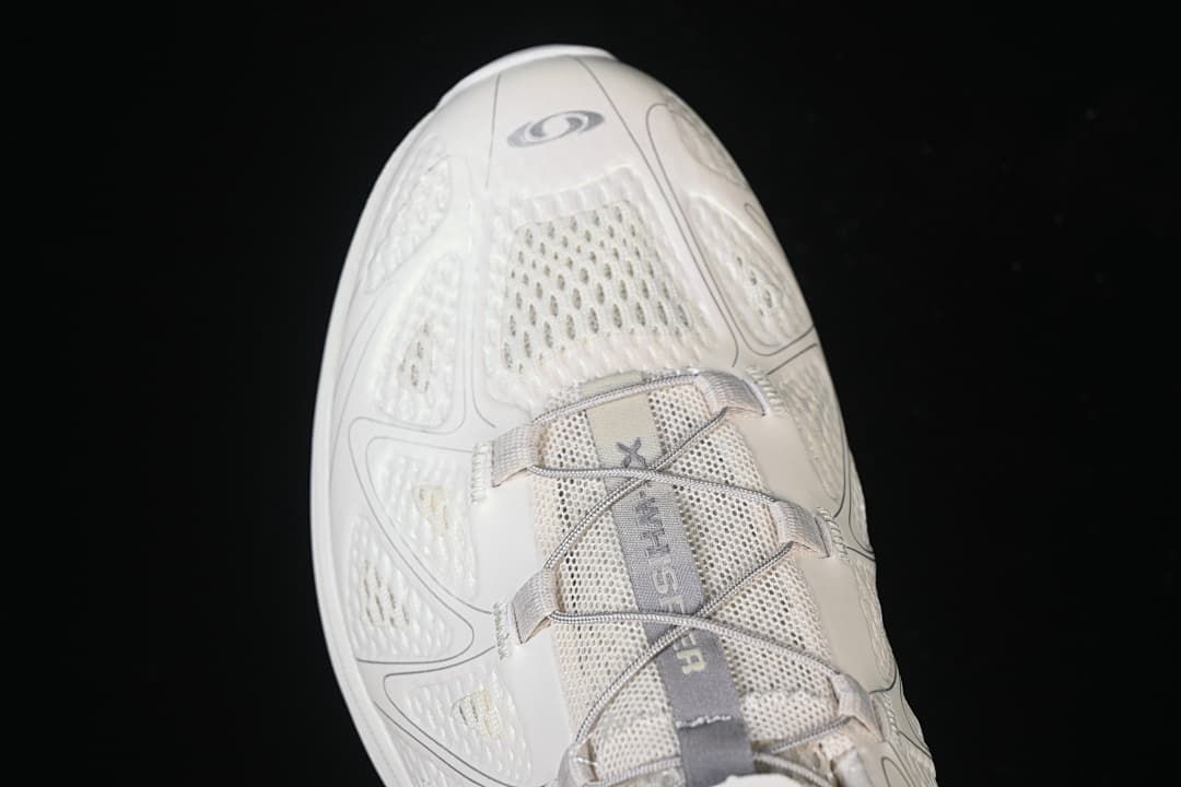 Top view highlighting the toe, mesh panels, and lacing