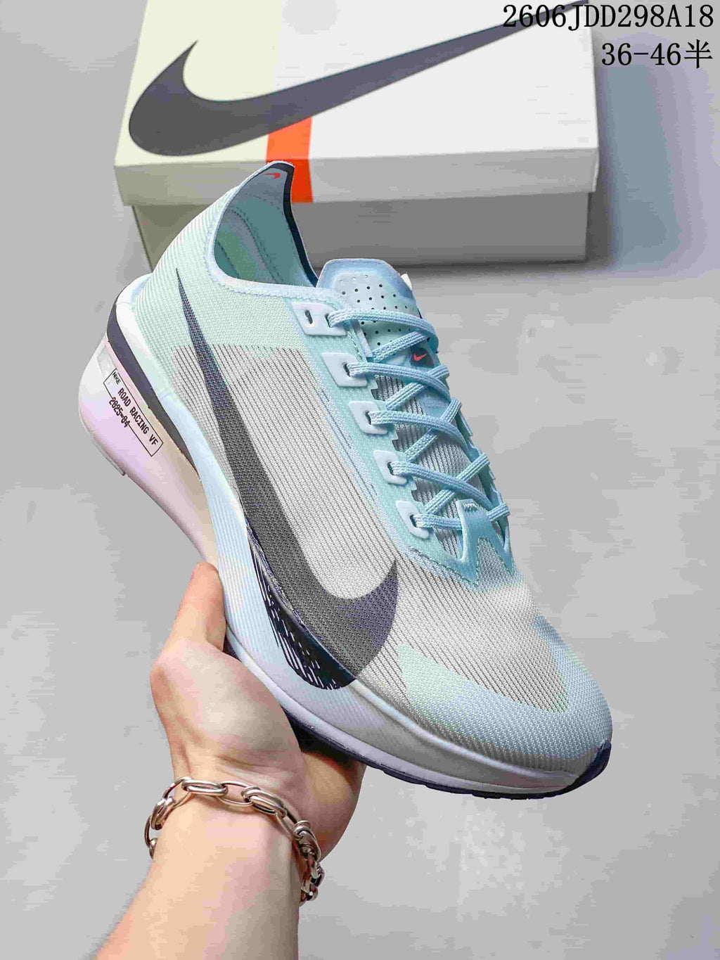 Angled side view of a pale blue Nike ZoomX Vaporfly NEXT% 4 shoe