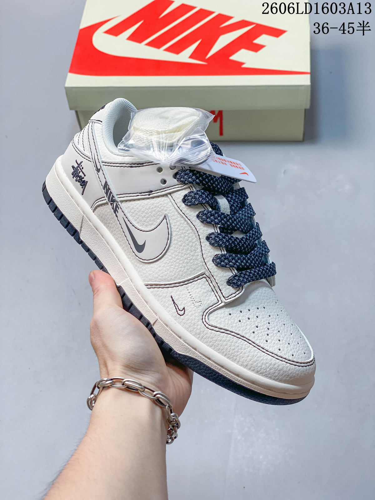 Angled view of the sneaker with an extra set of white laces