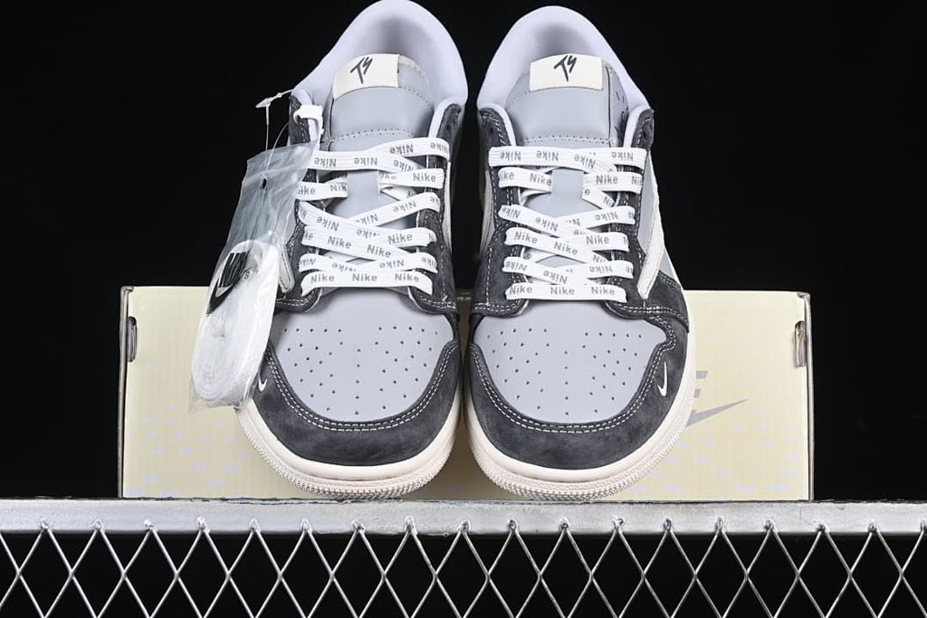Front view of the pair with perforated toe boxes and branded laces