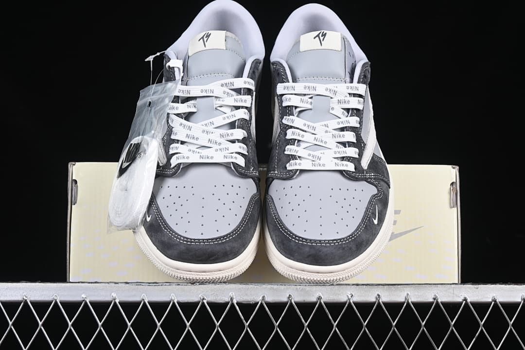 Front view of the pair with perforated toe boxes and branded laces