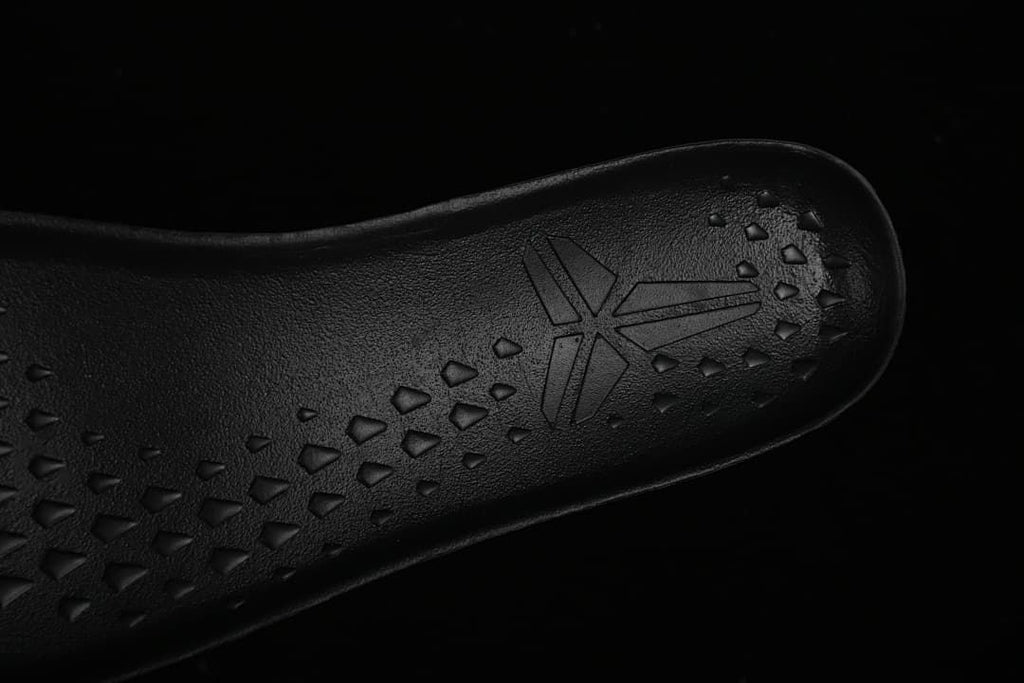 Close-up of the textured insole and Kobe logo inside the shoe.