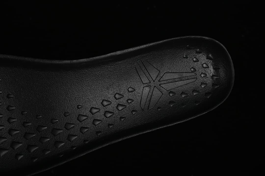 Close-up of the textured insole and Kobe logo inside the shoe.