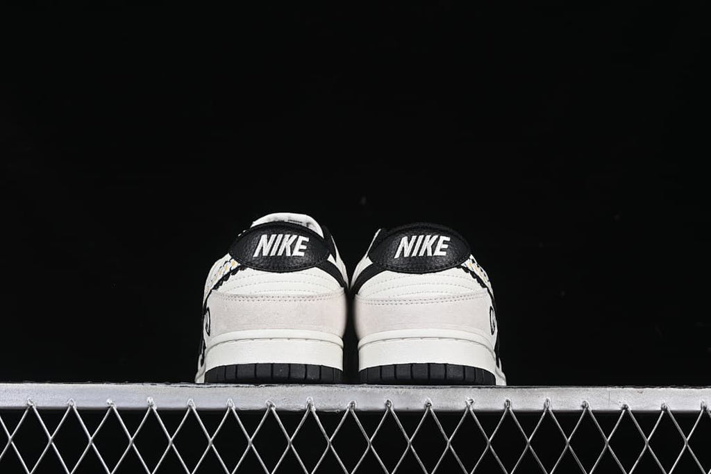 Rear view of the pair showing Nike heel tabs and black outsoles