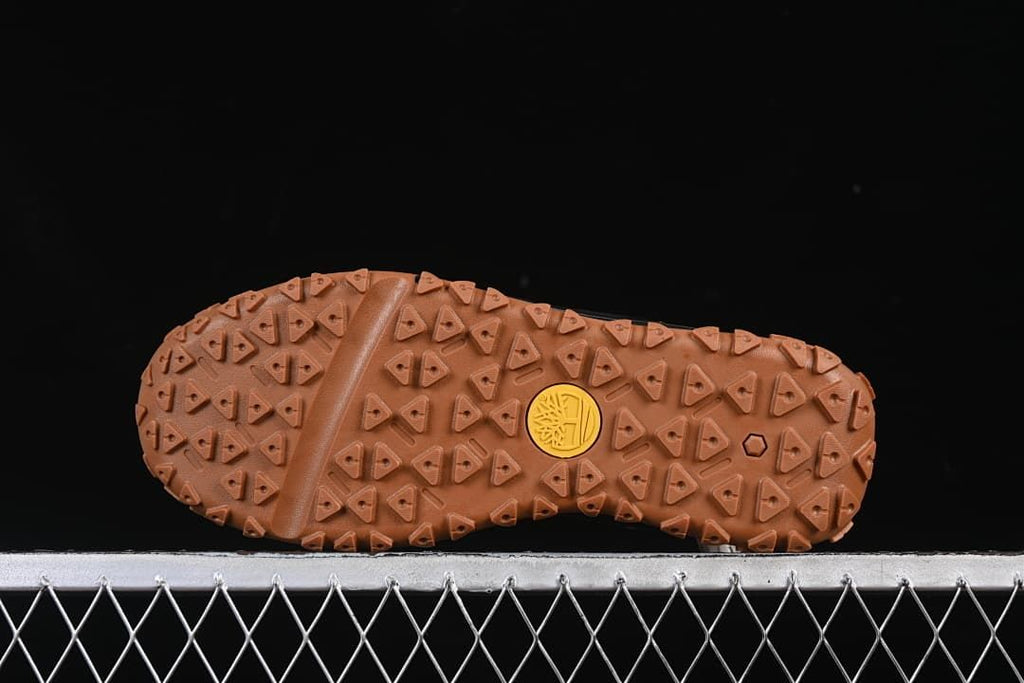 Underside view showing the brown patterned boot outsole
