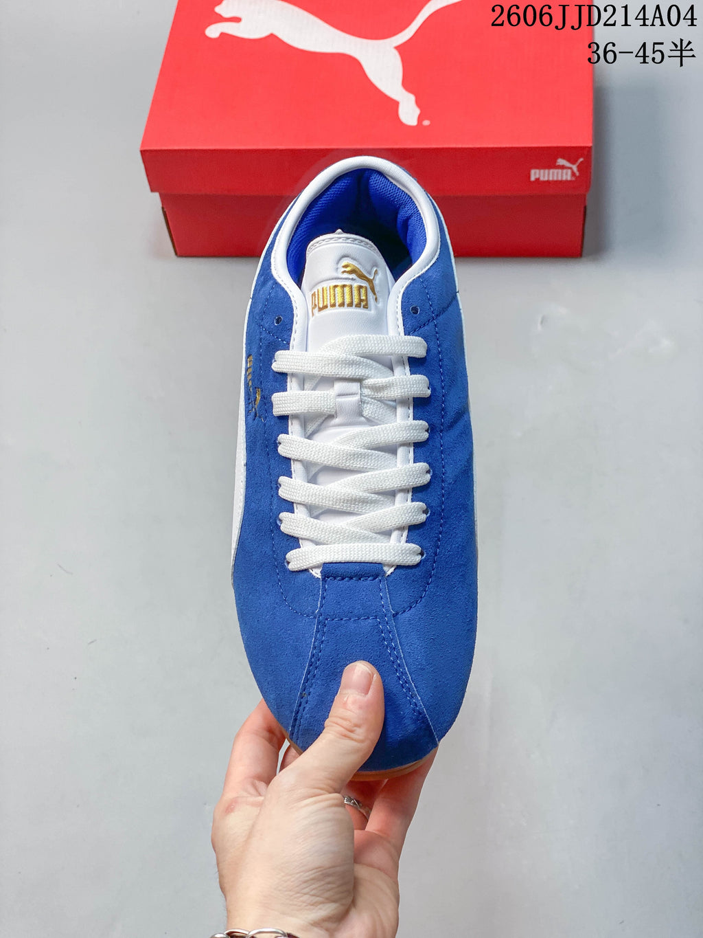 Top view of the blue Puma Tackle sneaker with white laces