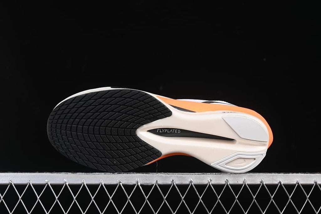Bottom view showing the black outsole sections and sculpted sole