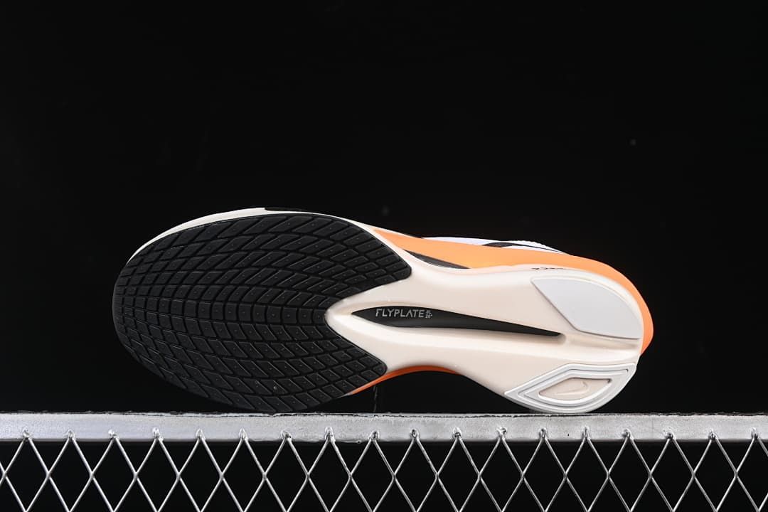 Bottom view showing the black outsole sections and sculpted sole