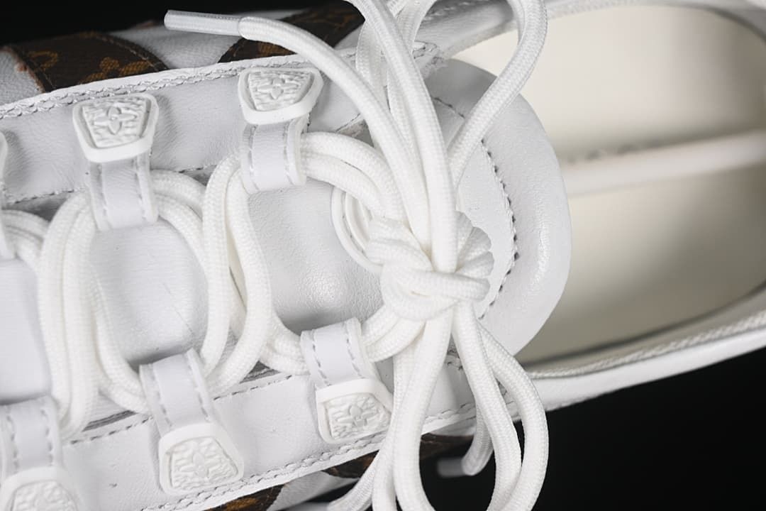 Close-up of the white laces and loop-style lace guides.