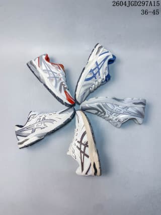 Four white ASICS sneakers arranged in a radial pattern, showing blue, red, and dark accent variations.