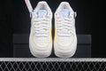 Pair of white Nike Air Force 1 Shadow sneakers with light blue and yellow accents shown from the front.