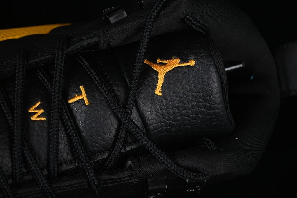 Close-up of the tongue logo and black laces