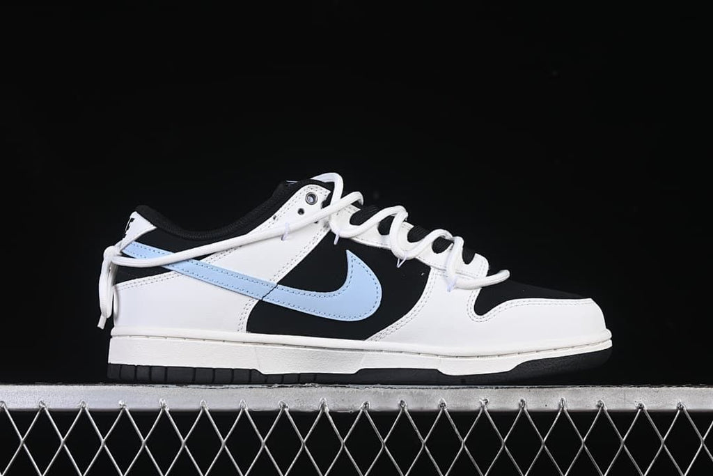 Lateral side view of the low-top sneaker with light blue Swoosh