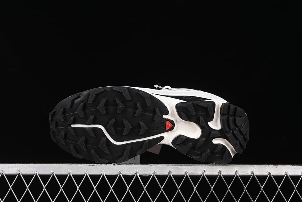 Underside view showing the black lugged outsoles.