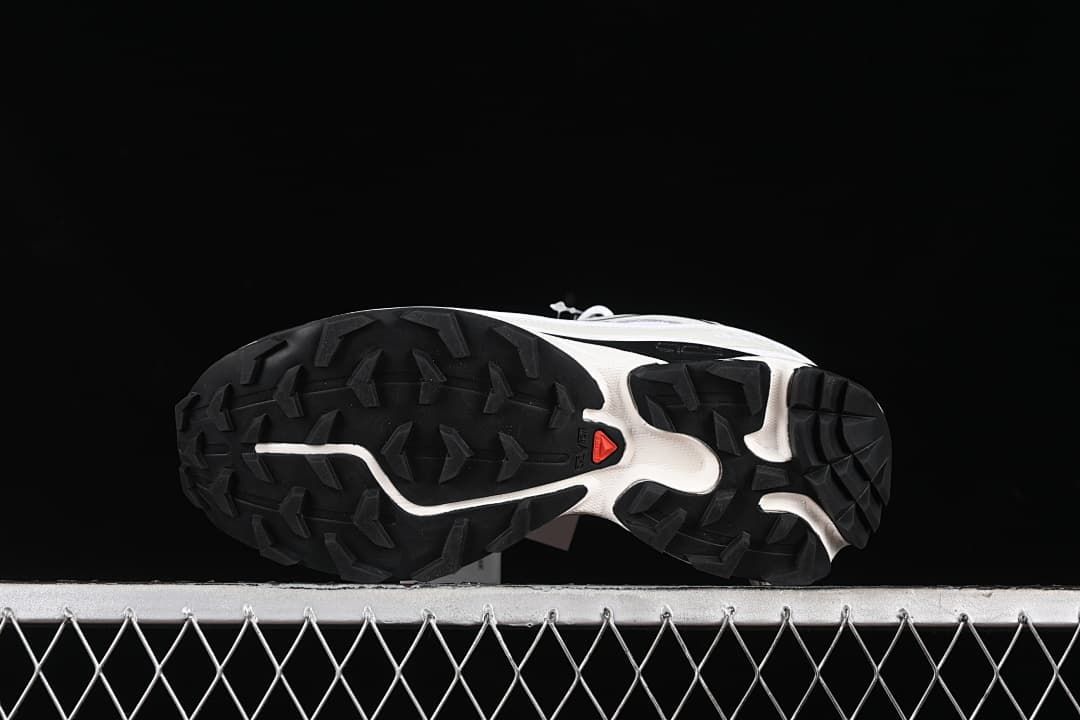 Underside view showing the black lugged outsoles.