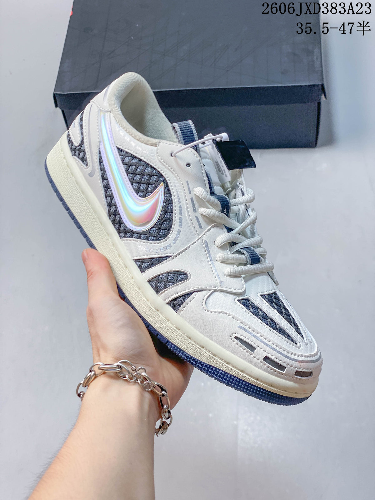 Angled side view showing the off-white upper, iridescent Swoosh, and blue outsole