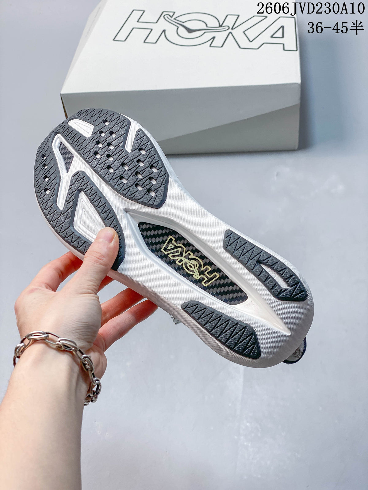 Underside of a HOKA Rocket X 3 shoe showing the patterned outsole.