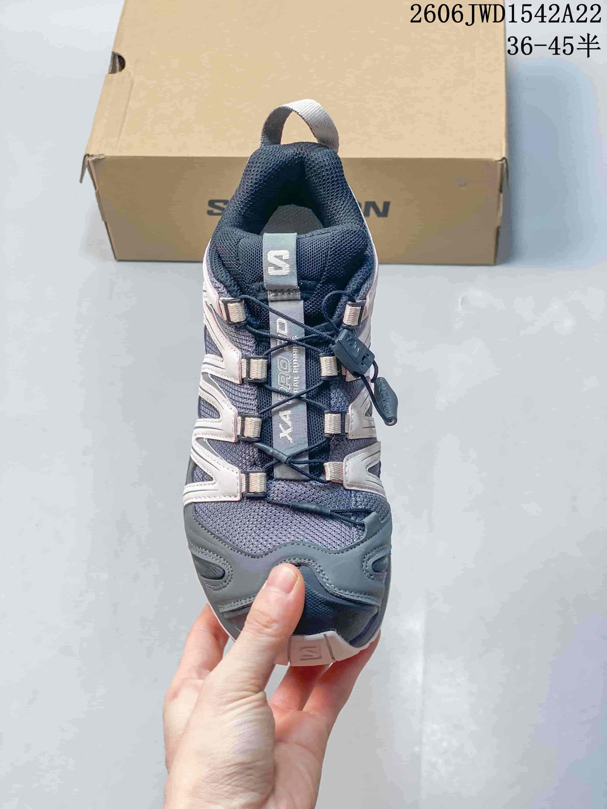 Top view of the mesh-look upper and quick-lace system on a Salomon sneaker