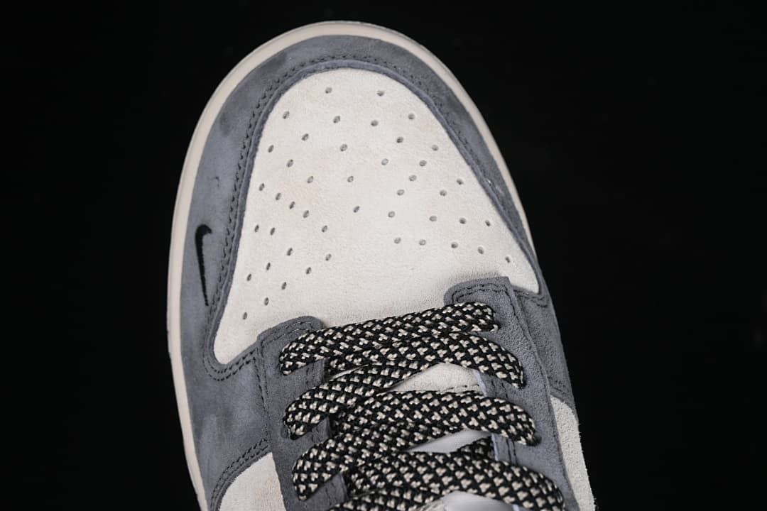 Top-down close-up of the perforated toe and laces
