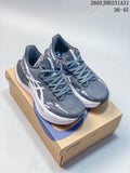 Gray and white ASICS MEGABLAST running shoes shown on a shoebox