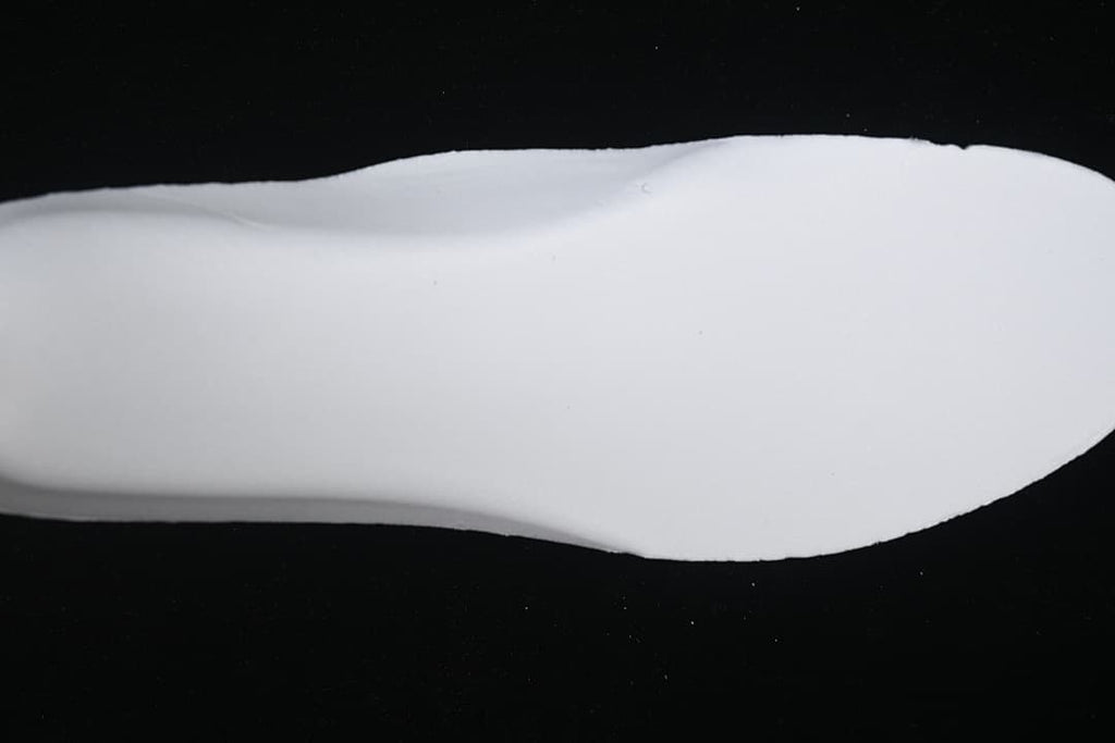 White outsole shown against a dark background.