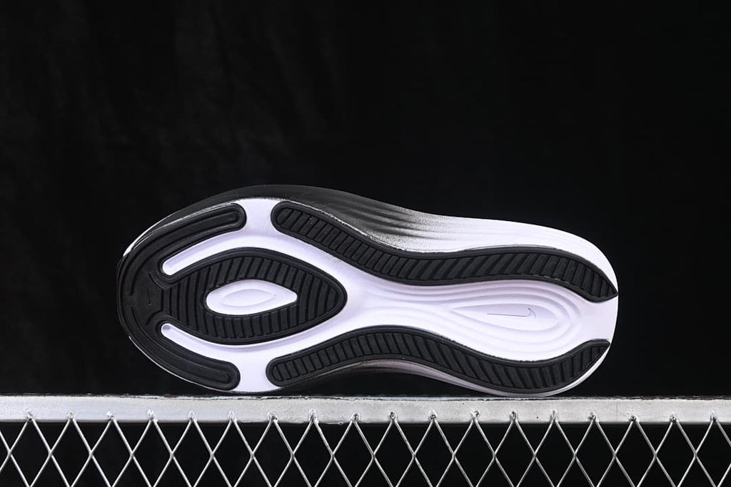Underside of the shoe showing the black-and-white patterned outsole