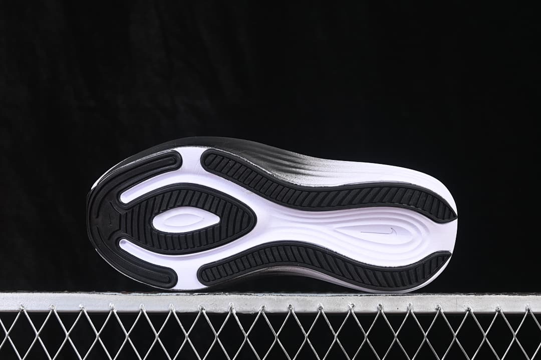 Underside of the shoe showing the black-and-white patterned outsole