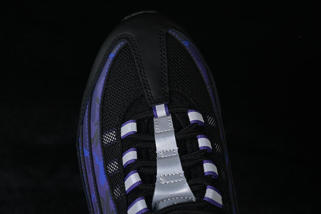 Top-down detail of the black mesh toe and lace area with silver accents