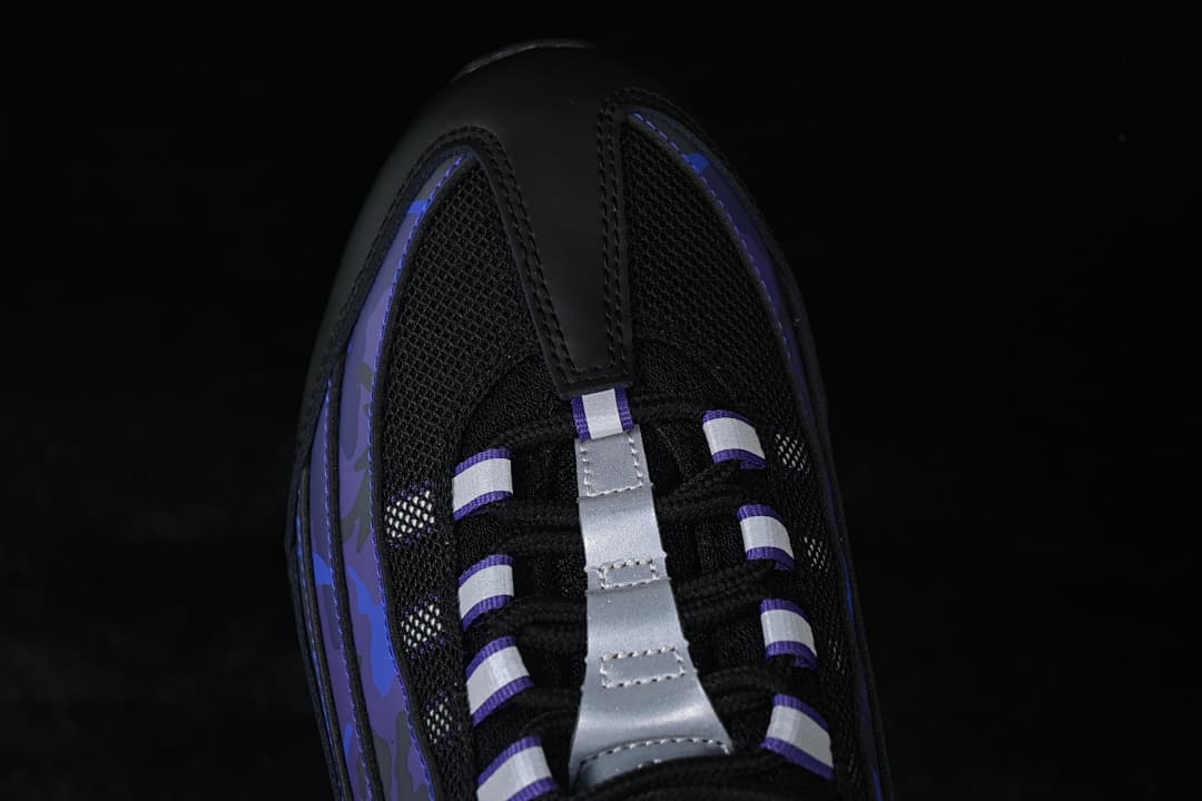 Top-down detail of the black mesh toe and lace area with silver accents