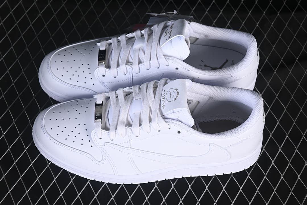 Pair of white low-top sneakers viewed from above and the side