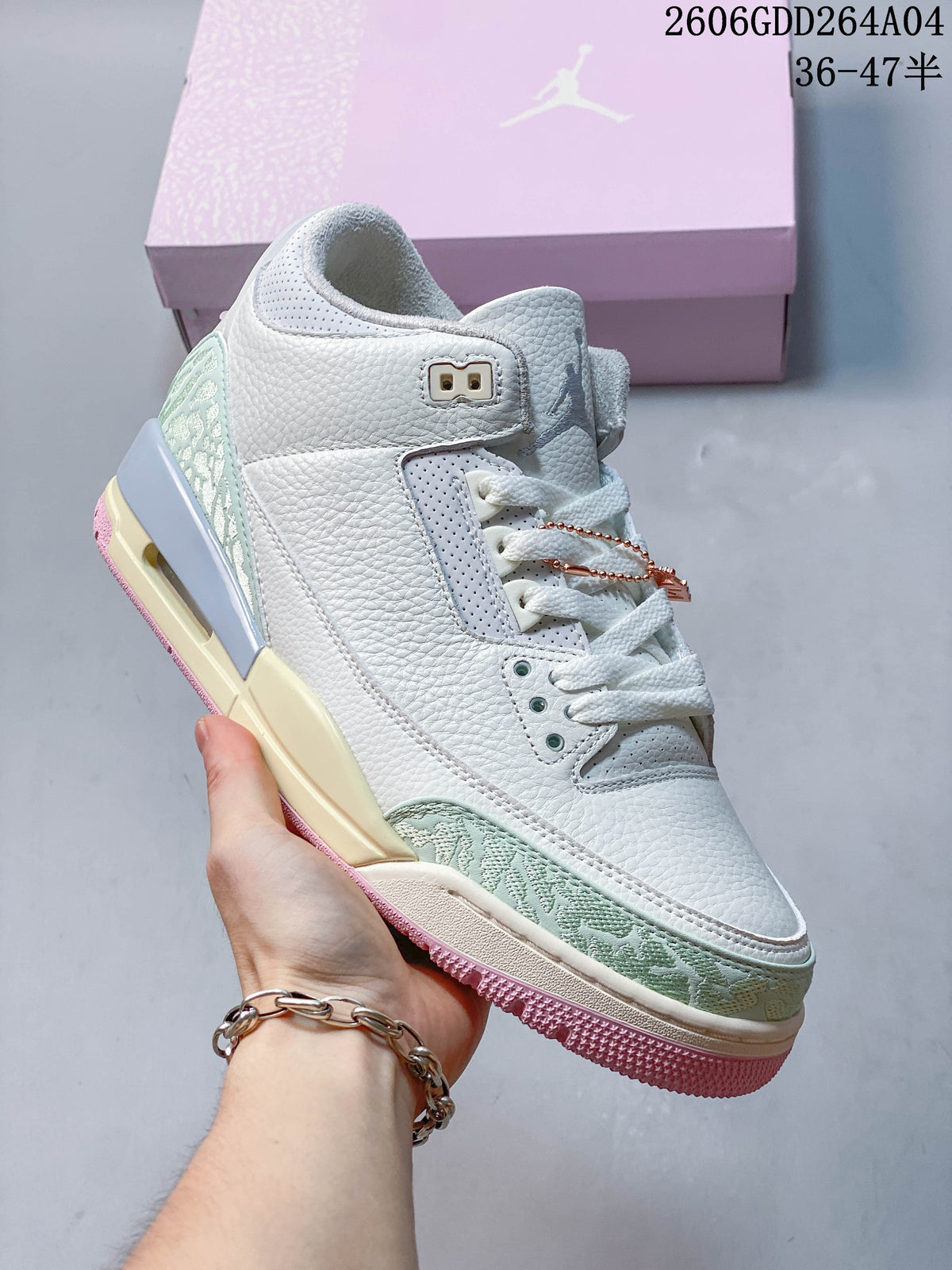 Angled side view of the sneaker showing its Sail upper and pink outsole.