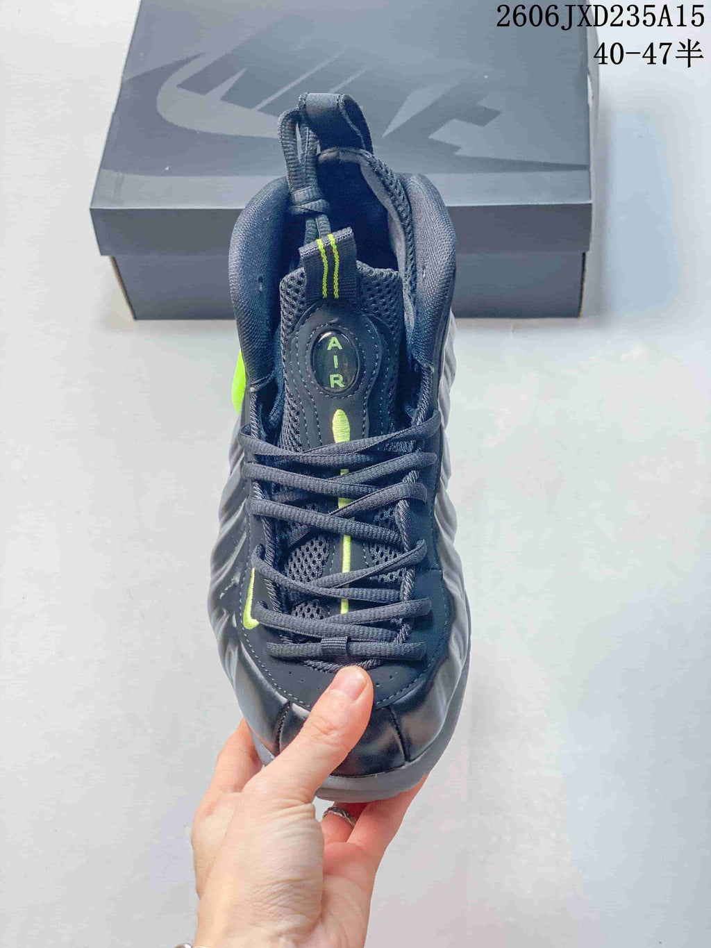 Top view of the shoe showing its laces, tongue, and bright green accents.