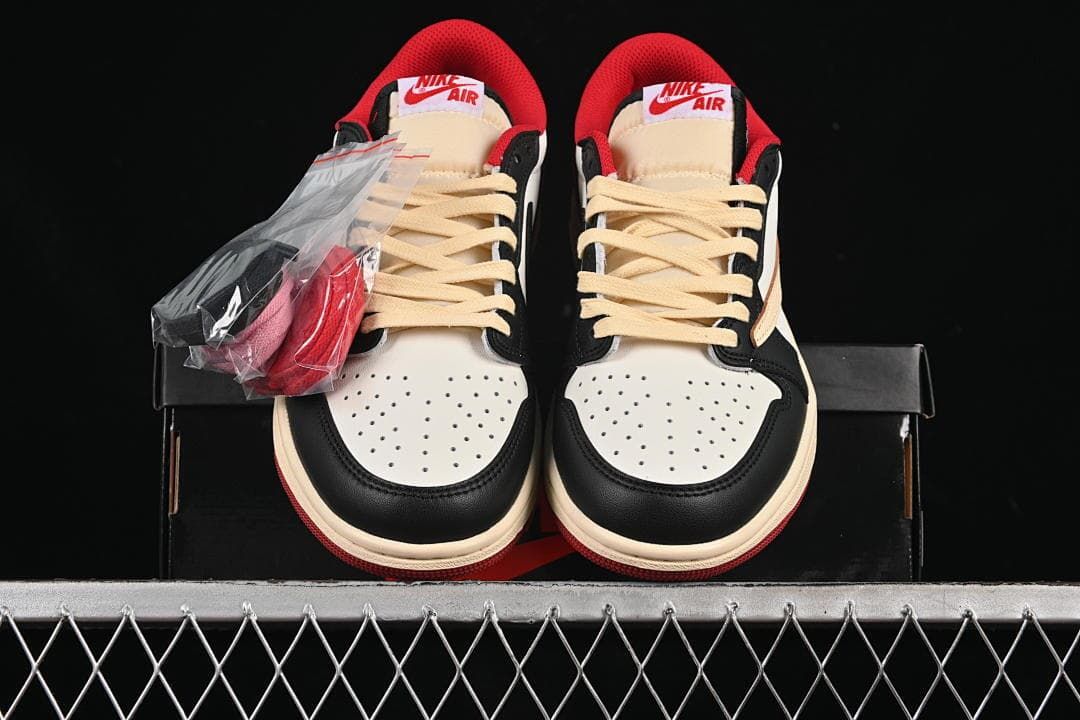 Front view of the pair with cream laces and a spare-lace packet