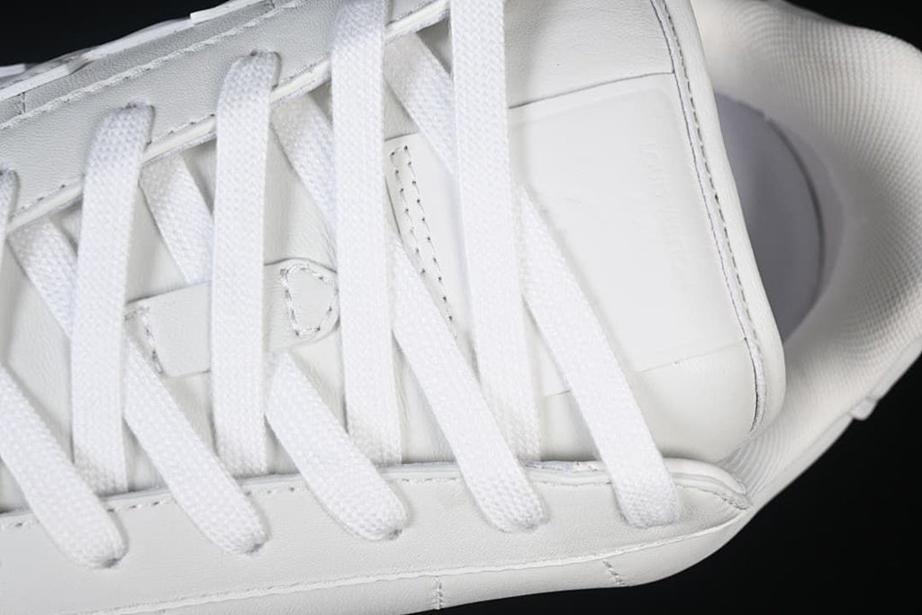 Close-up of white laces and upper panels