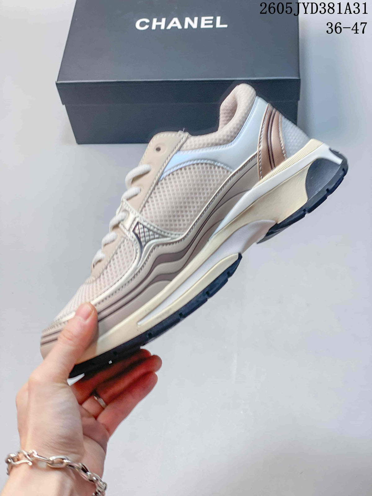 Side view of the cream sneaker showing mesh panels, layered accents and a thick sole