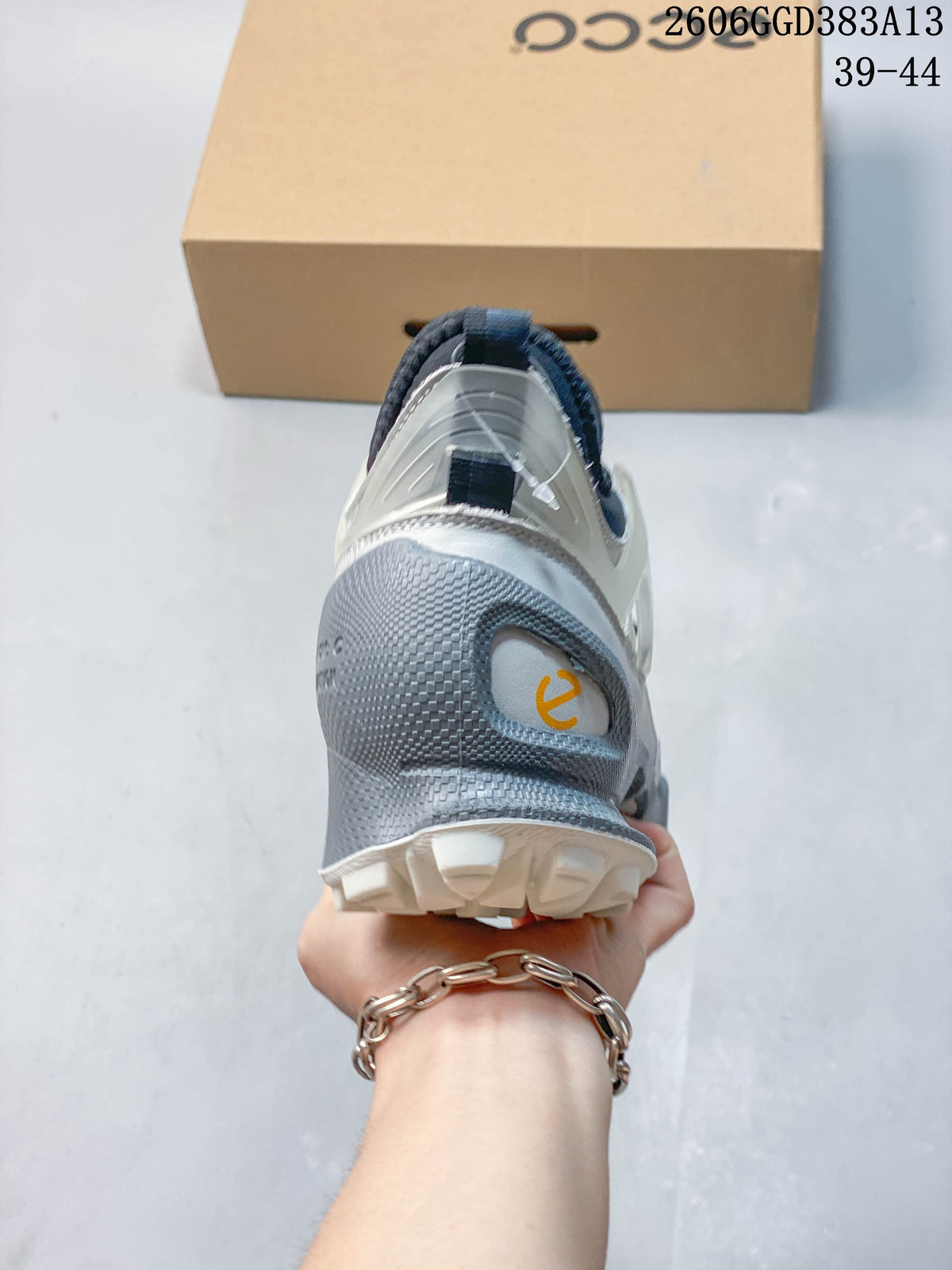 Rear view of the sneaker showing its gray heel structure and dark pull tab.