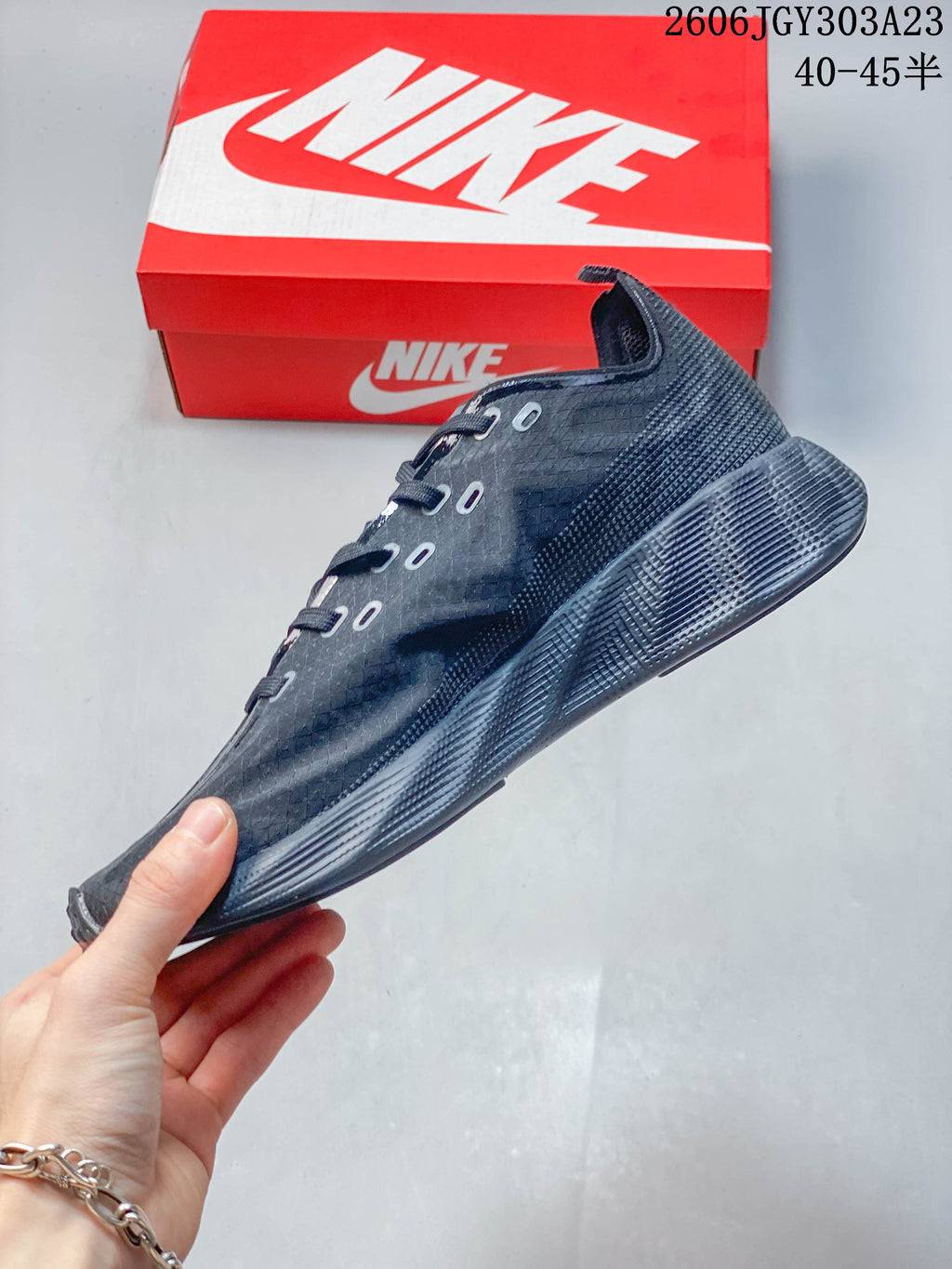 Side profile of a dark Nike Ava Rover low-top shoe