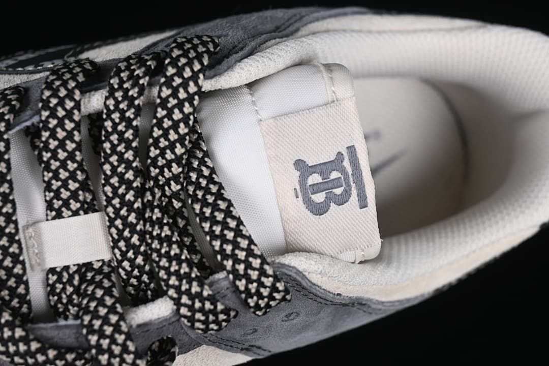 Top detail of the tongue, collar, and patterned laces