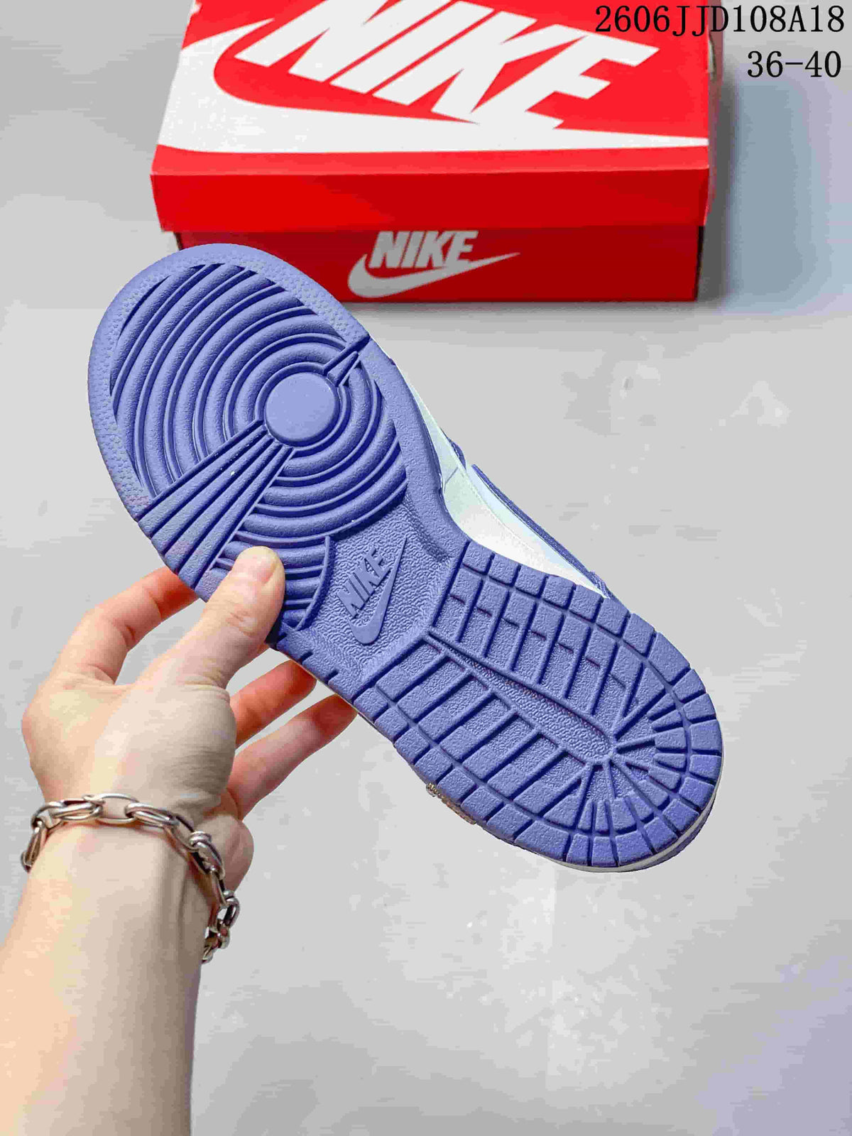 Close-up of the purple outsole and circular tread pattern.
